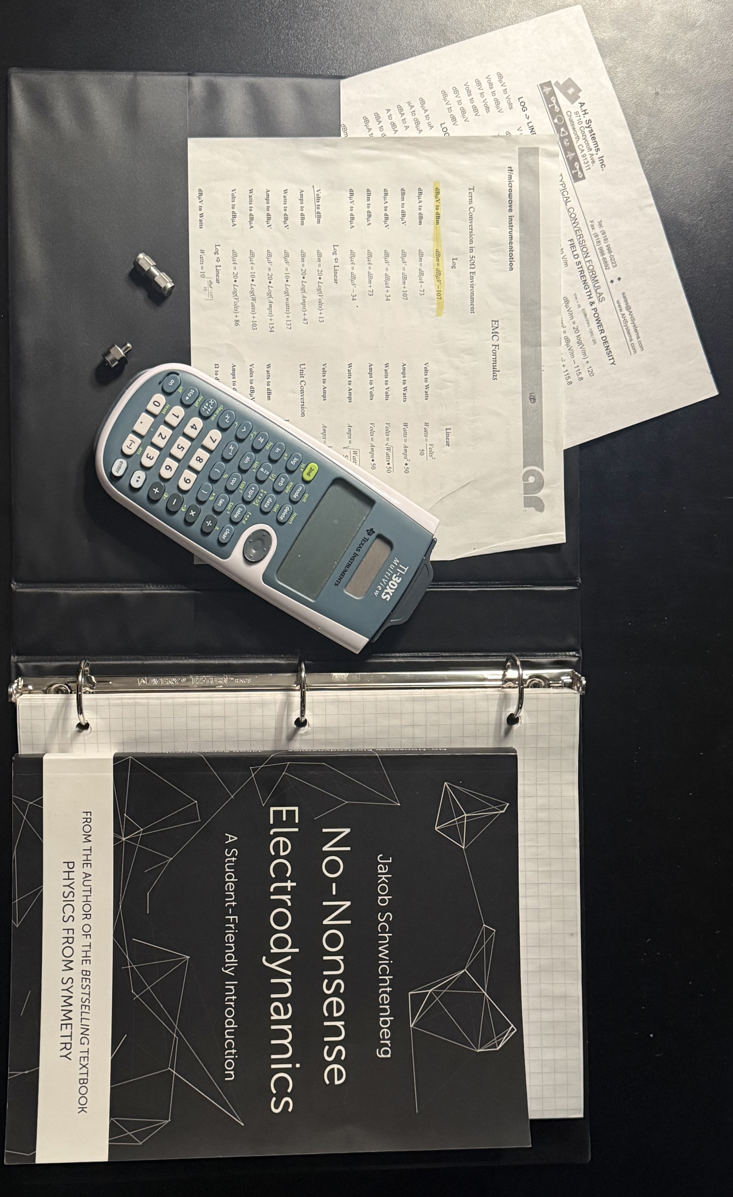 EMC reference notes, calculator, and electrodynamics book from my time at the U.S. Army Electronic Proving Grounds.